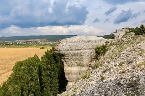 Clouds over the rocks. Stock Photos