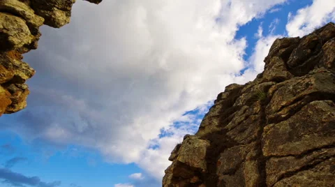 Clouds over rocks timelapse Stock Footage 47084564