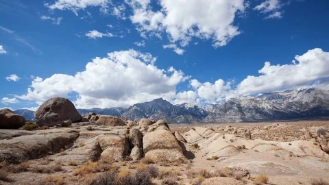 Clouds Over A Rocky Desert and Mountain Landscape Video stock 76630035