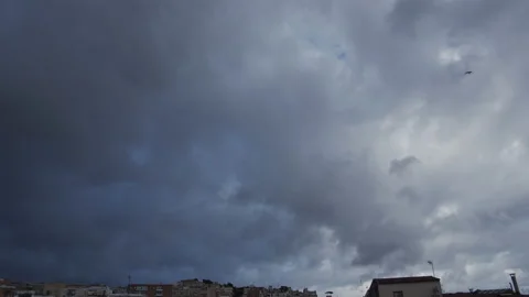 Clouds over rooftops Stock Footage 131153189
