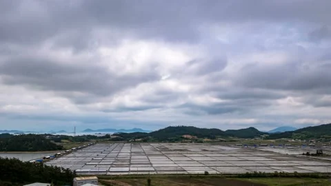 Clouds over a salt evaporation pond 스톡 동영상 145572116