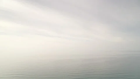 Clouds over sea, hazy day Stock Footage 127615276
