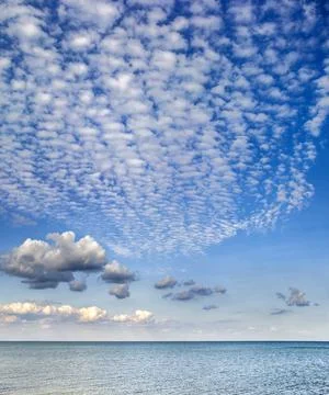 Clouds over the sea Stock Photos