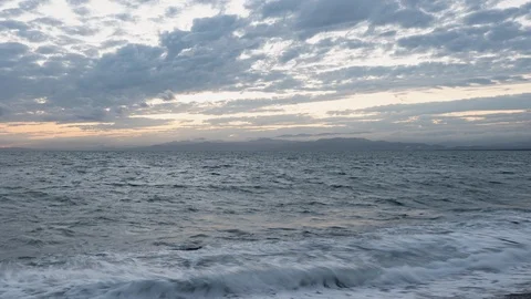 Clouds over a Sea at Sunset (time lapse/panning) Stock Footage 116904130