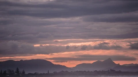 Clouds over silhouette mountains at sunset Video stock 94884803