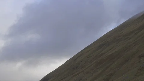 Clouds over a slope of a hill in the Scottish Highlands Stock Footage 86736295