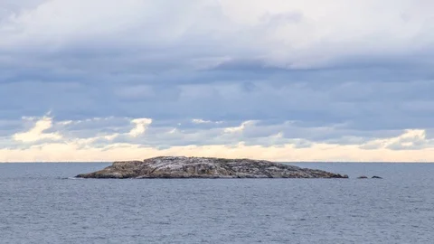 Clouds over small island on lake superior Stock Footage 100138624