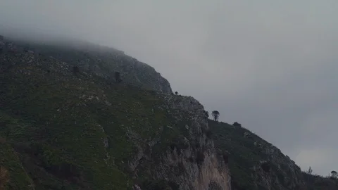 Clouds over a small mountain in Europe Stock Footage 88687614