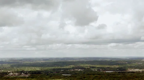 Clouds over a small town valley Stock Footage 31648432