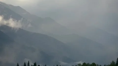 Clouds over snow-capped mountain peaks Stock Footage 257473257