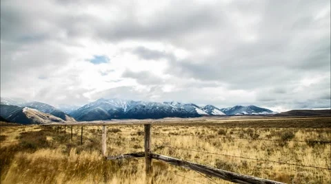 Clouds Over Snow Filled Mountians Stock Footage 52040730