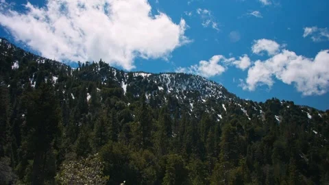 Clouds over a snowy mountain Stock Footage 272496092