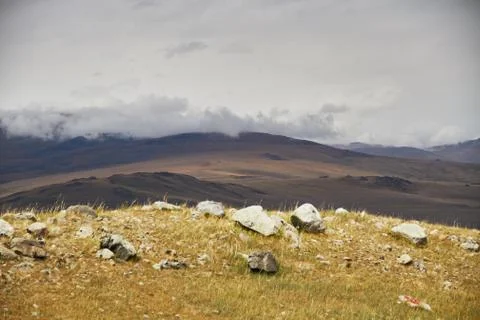 Clouds over the steppe open spaces, storm clouds over the hills. The Ukok Pla Stock Photos