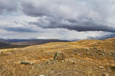 Clouds over the steppe open spaces, storm clouds over the hills. The Ukok Pla Stock Photos