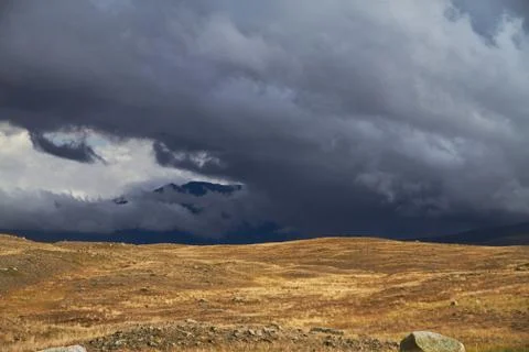 Clouds over the steppe open spaces, storm clouds over the hills. The Ukok Pla Stock Photos