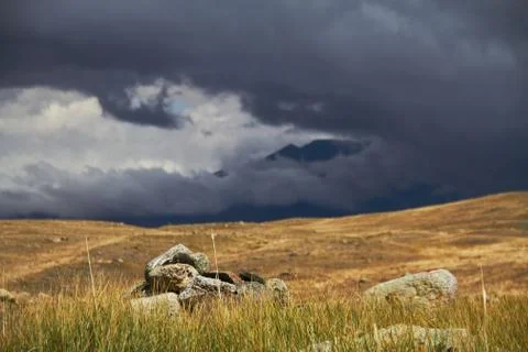 Clouds over the steppe open spaces, storm clouds over the hills. The Ukok Pla Stock Photos