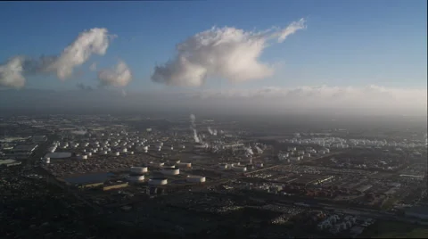 Clouds over storage tanks of an industrial plant near Los Angeles. Shot in 2010. Stock Footage 59112739