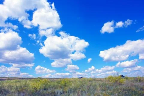 Clouds over a summer meadow Stock-Fotos