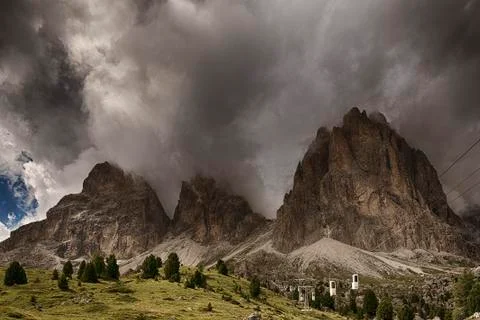 Clouds over the top of the mountains Stock Photos