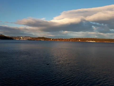 Clouds over the undulating sea Stock Photos