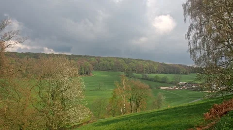 Clouds over a valley and a farm Video stock 62488610