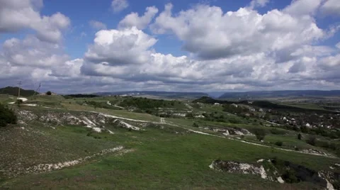 Clouds over the valley with settlement Stock Footage 50127885