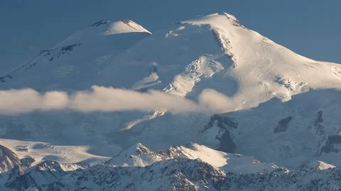 Clouds over volcano Mount Elbrus in the autumn at sunset Stock Footage 70152739