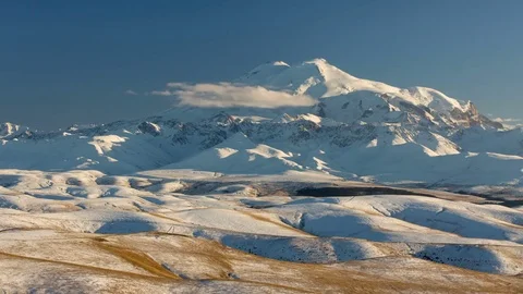 Clouds over volcano Mount Elbrus in the autumn at sunset Stock Footage 70153907