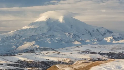 Clouds over volcano Mount Elbrus in the autumn at sunset Stock Footage 70190360