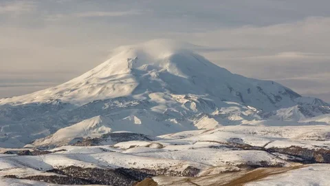 Clouds over volcano Mount Elbrus in the autumn at sunset Stock Footage 70191139