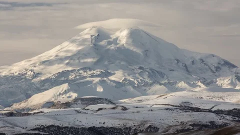 Clouds over volcano Mount Elbrus in the autumn at sunset Stock Footage 70299175