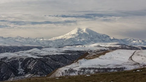 Clouds over volcano Mount Elbrus in the autumn at sunset Stock Footage 70299499