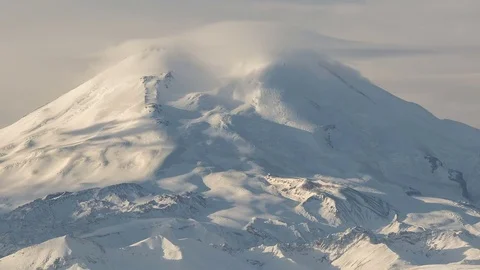 Clouds over volcano Mount Elbrus in the autumn at sunset Stock Footage 70301333