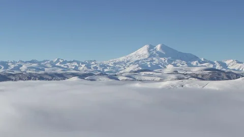 Clouds over volcano Mount Elbrus in the autumn at sunset Stock Footage 70408176