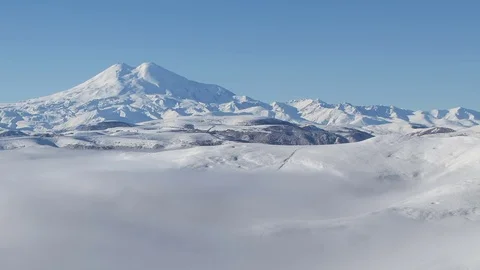 Clouds over volcano Mount Elbrus in the autumn at sunset Stock Footage 70408429