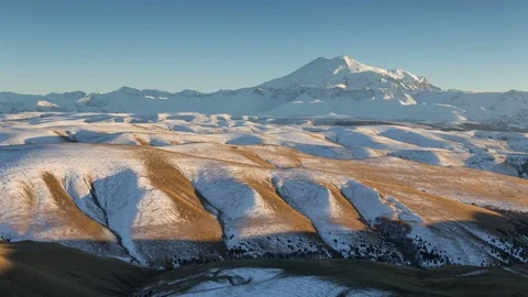 Clouds over volcano Mount Elbrus in the autumn at sunset Stock Footage 70455589