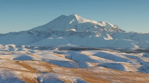 Clouds over volcano Mount Elbrus in the autumn at sunset Stock Footage 70456348