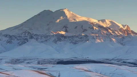 Clouds over volcano Mount Elbrus in the autumn at sunset Video stock 70456576