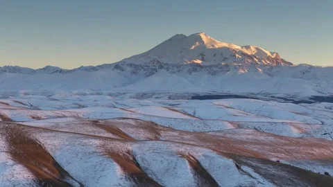 Clouds over volcano Mount Elbrus in the autumn at sunset Stock Footage 70456752