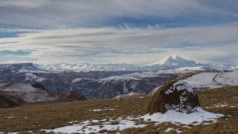 Clouds over volcano Mount Elbrus in the autumn at sunset Stock Footage 70489377