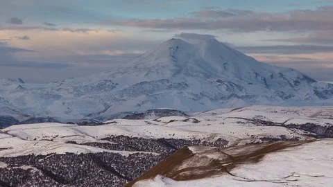 Clouds over volcano Mount Elbrus in the autumn at sunset Stock Footage 70491529