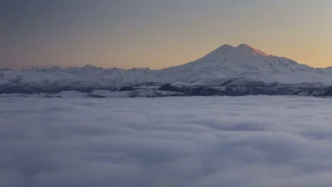 Clouds over volcano Mount Elbrus in the autumn at sunset Stock Footage 70500903