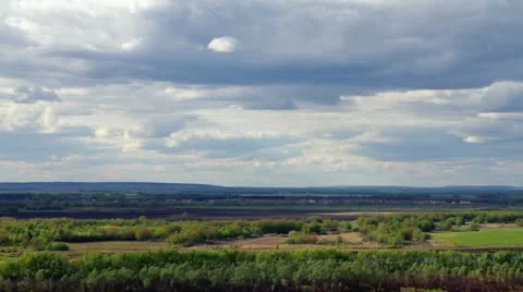 Clouds over the woods and fields Stock Footage 10947246