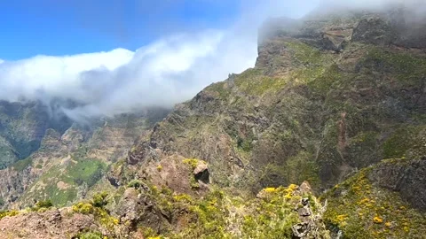 Clouds overflowing like a wave over mountains in Madeira.Timelapse Stock Footage 248995612