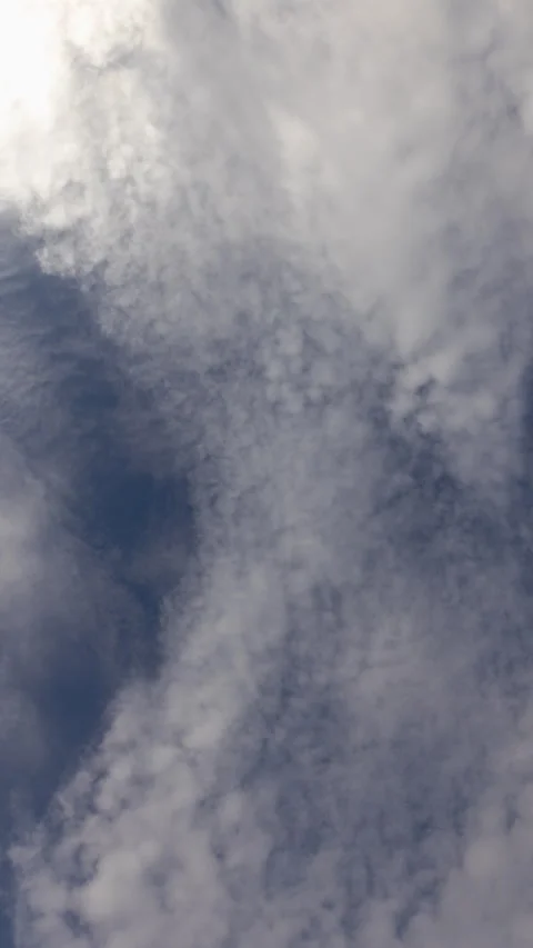 Clouds overhead blue sky vertical timelapse from below Stock Footage 330368337