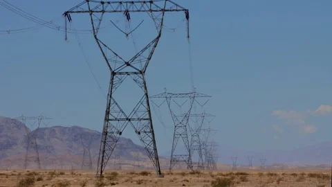 Clouds pass behind desert power line, time lapse, 4K. Stock Footage 111088392