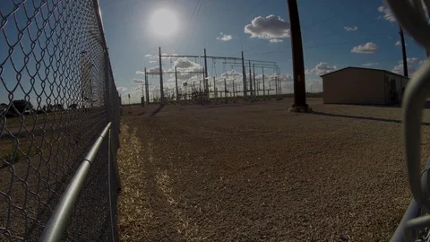 Clouds pass behind an electrtic power relay station, 4K. Stock Footage 92076576