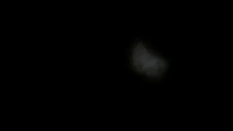 Clouds pass fast in front of 2025 Solar eclipse as moon shadow passing the sun Stock Footage 305717880