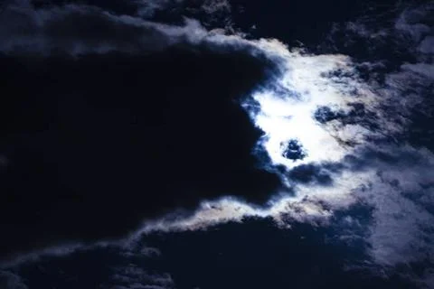  Clouds pass in front of the moon in a night sky Moon cloud and sky Copyri... Stock Photos