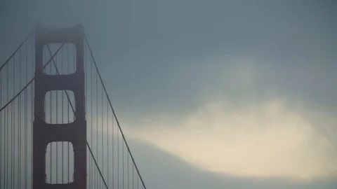 Clouds pass in front of the top of the Golden Gate bridge Stock Footage 92714437